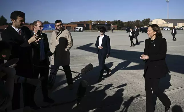 Democratic presidential nominee Vice President Kamala Harris talks to reporters before boarding Air Force Two, Wednesday, Oct. 30, 2024, at Joint Base Andrews, Md. (Brendan Smialowski/Pool via AP)