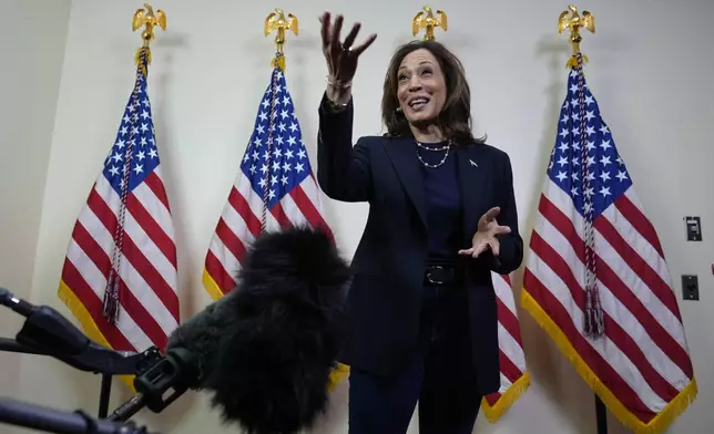 Democratic presidential nominee Vice President Kamala Harris speaks with reporters after attending a service at the Church of Christian Compassion, Sunday, Oct. 27, 2024, in Philadelphia. (AP Photo/Susan Walsh)