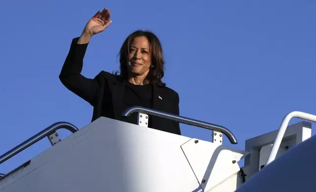 Democratic presidential nominee Vice President Kamala Harris boards Air Force Two at Charlotte Douglas International Airport, Saturday, October 5, 2024, in Charlotte, N.C., after a briefing on the damage from Hurricane Helene. (AP Photo/Chris Carlson)