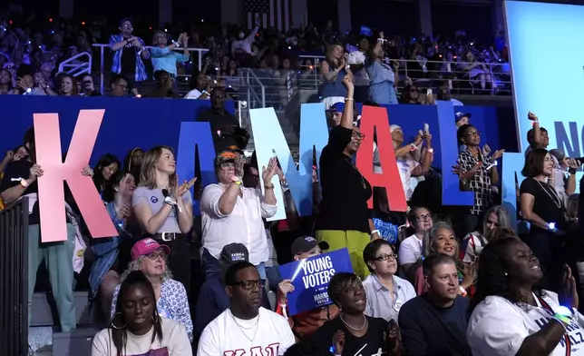 Attendees are pictured in the audience before Democratic presidential nominee Vice President Kamala Harris arrives to speak at a campaign rally at East Carolina University in Greenville, N.C., Sunday, Oct. 12, 2024. (AP Photo/Susan Walsh)