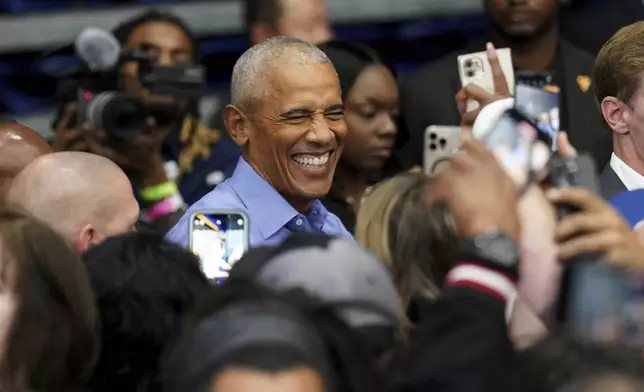 Former President Barack Obama greets attendees after speaking at a campaign rally supporting Democratic presidential nominee Vice President Kamala Harris, Thursday, Oct. 10, 2024, at the University of Pittsburgh's Fitzgerald Field House in Pittsburgh. (AP Photo/Matt Freed)