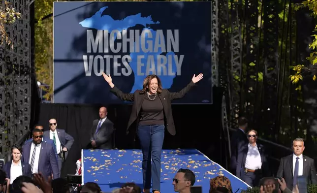 Democratic presidential nominee Vice President Kamala Harris arrives to speak at a campaign rally in Riverside Park, Friday, Oct. 18, 2024, in Grand Rapids, Mich. (AP Photo/Paul Sancya)