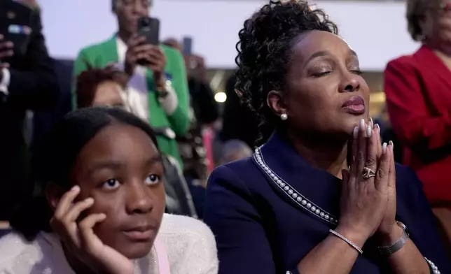 Attendees listen as Stevie Wonder performs "Redemption Song" during a church service and early vote event with Democratic presidential nominee Vice President Kamala Harris at Divine Faith Ministries International, Sunday, Oct. 20, 2024, in Jonesboro, Ga. (AP Photo/Jacquelyn Martin)