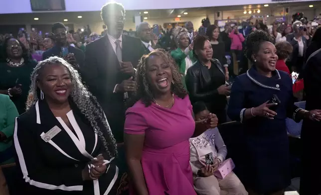 Attendees sing "Happy Birthday" as Stevie Wonder performs for Democratic presidential nominee Vice President Kamala Harris' birthday during a church service and early vote event at Divine Faith Ministries International, Sunday, Oct. 20, 2024, in Jonesboro, Ga. (AP Photo/Jacquelyn Martin)