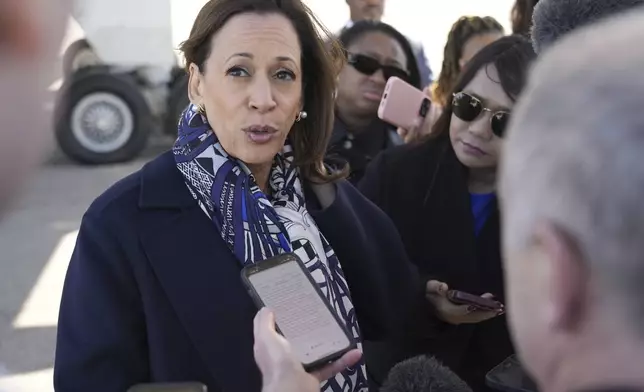 Democratic presidential nominee Vice President Kamala Harris speaks to the media before boarding Air Force Two on departure from Detroit, at Detroit Metropolitan Wayne County Airport, Wednesday, Oct. 16, 2024. (AP Photo/Jacquelyn Martin)