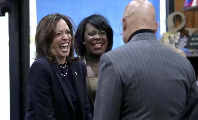 Democratic presidential nominee Vice President Kamala Harris, from left, and Philadelphia Mayor Cherelle Parker visit Hakim's Bookstore and Gift Shop during a campaign stop, Sunday, Oct. 27, 2024, in Philadelphia. (AP Photo/Susan Walsh)