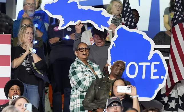 Supporters listen as democratic presidential nominee Vice President Kamala Harris speaks during a campaign rally at the Wings Event Center in Kalamazoo, Mich. (AP Photo/Jacquelyn Martin)