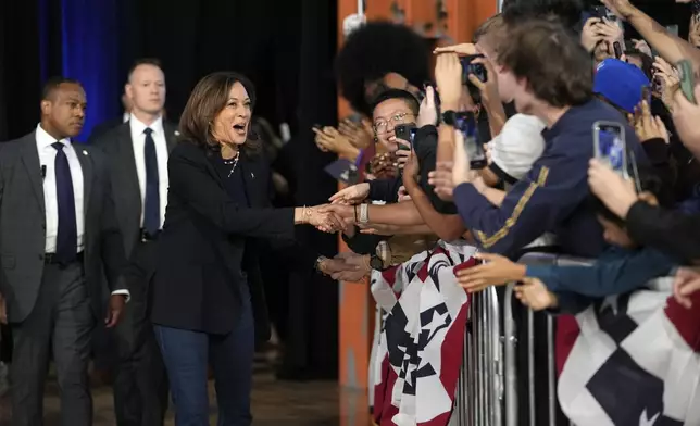 Democratic presidential nominee Vice President Kamala Harris greets supporters as she arrives to speak during a community rally at the Alan Horwitz "Sixth Man" Center, Sunday, Oct. 27, 2024, in Philadelphia. (AP Photo/Susan Walsh)