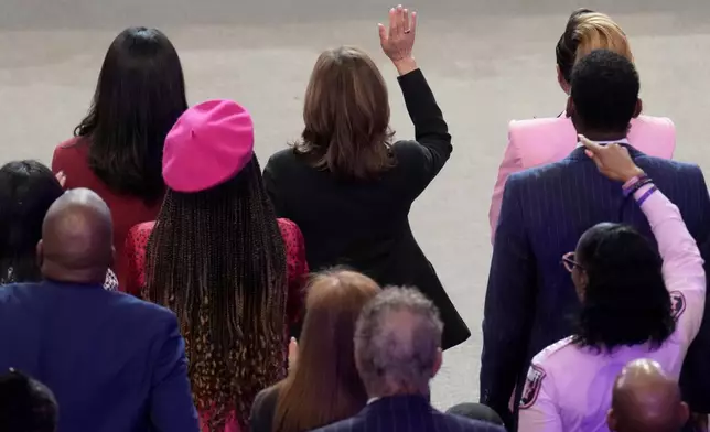 Democratic presidential nominee Vice President Kamala Harris, top center, attends a church service at New Birth Baptist Church in Stonecrest, Ga., Sunday, Oct. 20, 2024. (AP Photo/Jacquelyn Martin)