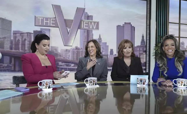 Democratic presidential nominee Vice President Kamala Harris chats with the hosts during a commercial break at The View, Tuesday, Oct. 8, 2024, in New York. From left are Ana Navarro, Harris, Joy Behar and Sunny Hostin. (AP Photo/Jacquelyn Martin)