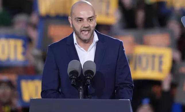 Assad Turfe, of Dearborn, Mich., speaks at a campaign rally for Democratic presidential nominee Vice President Kamala Harris at Burns Park in Ann Arbor, Mich., Monday, Oct. 28, 2024. (AP Photo/Carlos Osorio)