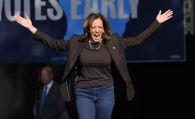 Democratic presidential nominee Vice President Kamala Harris arrives to speak at a campaign rally in Riverside Park, Friday, Oct. 18, 2024, in Grand Rapids, Mich. (AP Photo/Paul Sancya)