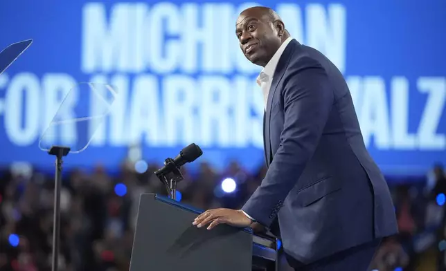 Magic Johnson speaks at a campaign rally for Democratic presidential nominee Vice President Kamala Harris at the Dort Financial Center in Flint, Mich., Friday, Oct. 4, 2024. (AP Photo/Mark Schiefelbein)