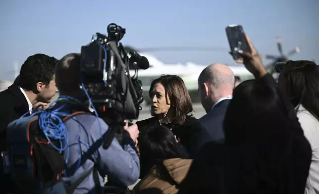 Democratic presidential nominee Vice President Kamala Harris talks to reporters before boarding Air Force Two, Wednesday, Oct. 30, 2024, at Joint Base Andrews, Md. (Brendan Smialowski/Pool via AP)