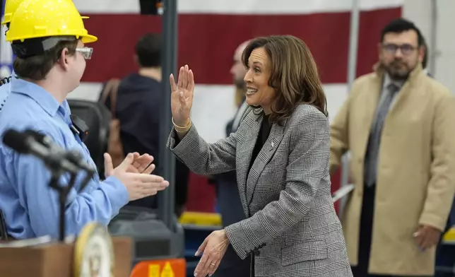 Democratic presidential nominee Vice President Kamala Harris greets employees after speaking at the Hemlock Semiconductor Next-Generation Finishing facility in Hemlock, Mich., Monday, Oct. 28, 2024. (AP Photo/Jacquelyn Martin)