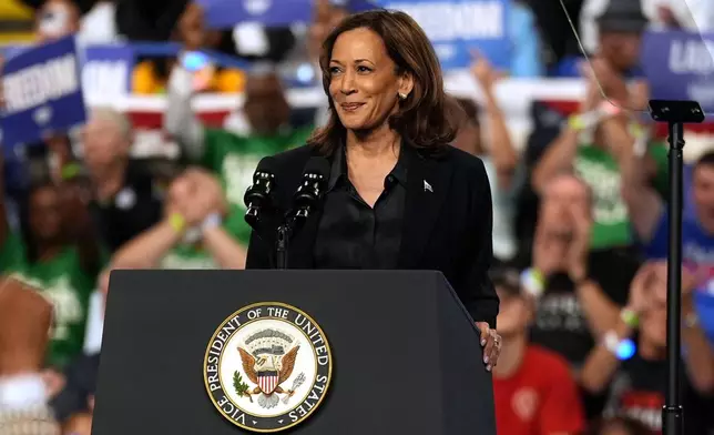 Democratic presidential nominee Vice President Kamala Harris speaks during a campaign rally at the Dort Financial Center in Flint, Mich., Friday, Oct. 4, 2024. (AP Photo/Carolyn Kaster)