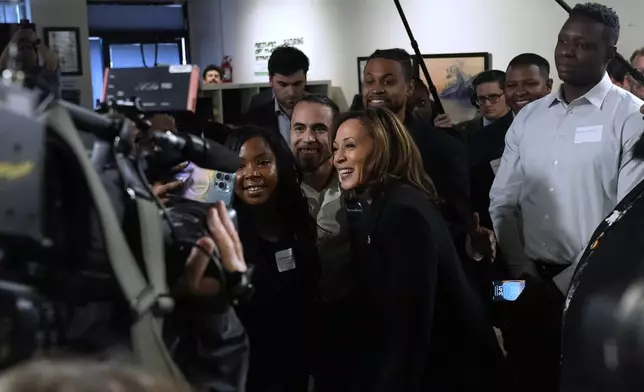 Democratic presidential nominee Vice President Kamala Harris poses for a photo as she visits Norwest Gallery of Art in Detroit, Tuesday, Oct. 15, 2024. (AP Photo/Jacquelyn Martin)