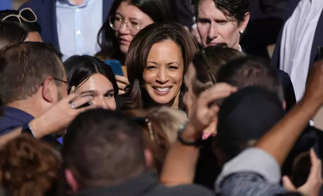 Democratic presidential nominee Vice President Kamala Harris greets supporters after speaking at a campaign rally in Riverside Park, Friday, Oct. 18, 2024, in Grand Rapids, Mich. (AP Photo/Paul Sancya)