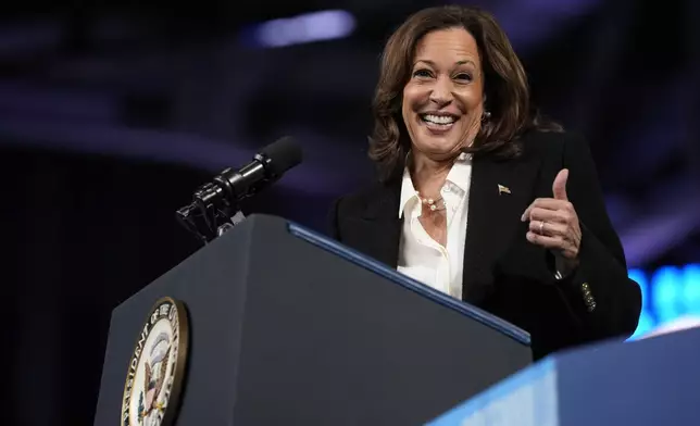 Democratic presidential nominee Vice President Kamala Harris gives a thumbs up as she speaks at a campaign rally at East Carolina University in Greenville, N.C., Sunday, Oct. 13, 2024. (AP Photo/Susan Walsh)