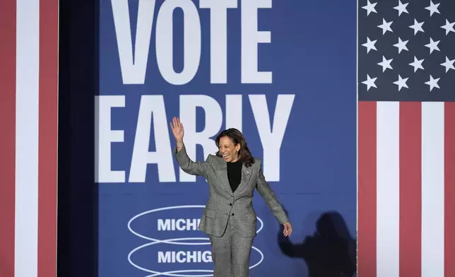 Democratic presidential nominee Vice President Kamala Harris arrives to speak during a campaign rally at Burns Park in Ann Arbor, Mich., Monday, Oct. 28, 2024. (AP Photo/Carlos Osorio)