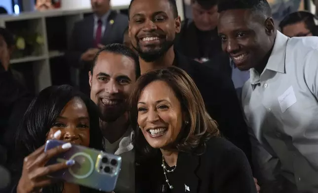 Democratic presidential nominee Vice President Kamala Harris poses for a photo as she visits Norwest Gallery of Art in Detroit, Tuesday, Oct. 15, 2024. (AP Photo/Jacquelyn Martin)