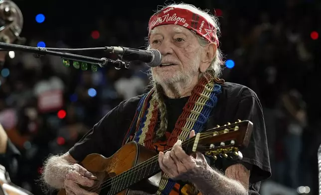 Musician Willie Nelson performing ahead of event for Democratic presidential nominee Vice President Kamala Harris at a rally in Houston, Friday, Oct. 25, 2024. (AP Photo/Susan Walsh)