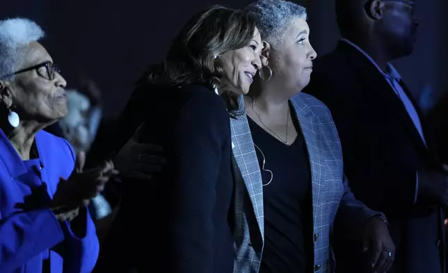 Democratic presidential nominee Vice President Kamala Harris, center, hugs bishop Rosie O'neal, during a church service at Koinonia Christian Center in Greenville, N.C., Sunday, Oct. 13, 2024. (AP Photo/Susan Walsh)