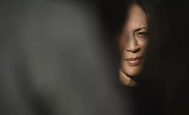 Democratic presidential nominee Vice President Kamala Harris speaks to the press before boarding Air Force Two at Joint Base Andrews, Md., Saturday, Oct. 12, 2024, en route to North Carolina for a campaign event. (Brendan Smialowski/Pool via AP)