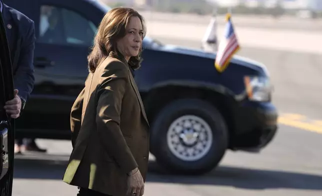 Democratic presidential nominee Vice President Kamala Harris walks to board Air Force Two, Friday, Oct. 11, 2024, at Sky Harbor International Airport in Phoenix, en route to Washington. (AP Photo/Ross D. Franklin)