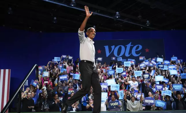 Former President Barack Obama arrives to speak at a campaign rally supporting Democratic presidential nominee Vice President Kamala Harris, Tuesday, Oct. 22, 2024, in Detroit. (AP Photo/Paul Sancya)