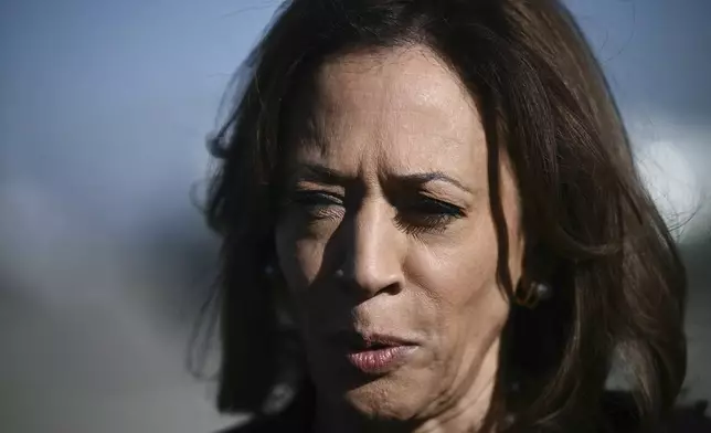 Democratic presidential nominee Vice President Kamala Harris talks to reporters before boarding Air Force Two, Wednesday, Oct. 30, 2024, at Joint Base Andrews, Md. (Brendan Smialowski/Pool via AP)