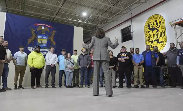 Democratic presidential nominee Vice President Kamala Harris tours the International Union of Painters and Allied Trades District Council 1M facilities, Monday, Oct. 28, 2024, in Warren, Mich. (AP Photo/Paul Sancya)