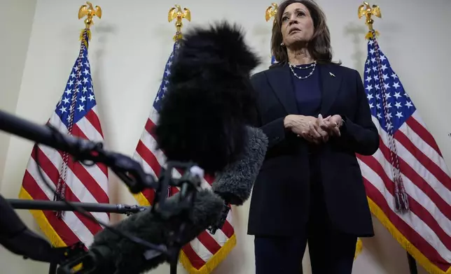 Democratic presidential nominee Vice President Kamala Harris speaks with reporters after attending a service at the Church of Christian Compassion, Sunday, Oct. 27, 2024, in Philadelphia. (AP Photo/Susan Walsh)