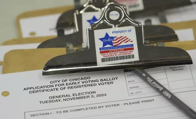 An application for early voting is on display during the first day of early voting for the 2024 Presidential General Election, Thursday, Oct. 3, 2024 in Chicago. (AP Photo/Charles Rex Arbogast)