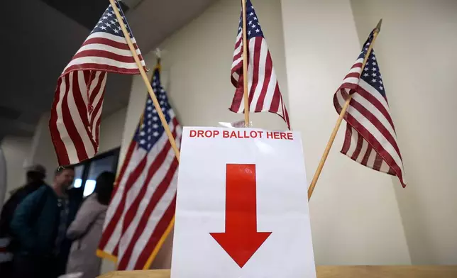 A ballot box is seen during early voting at the Polk County Election Office, Wednesday, Oct. 16, 2024, in Des Moines, Iowa. (AP Photo/Charlie Neibergall)