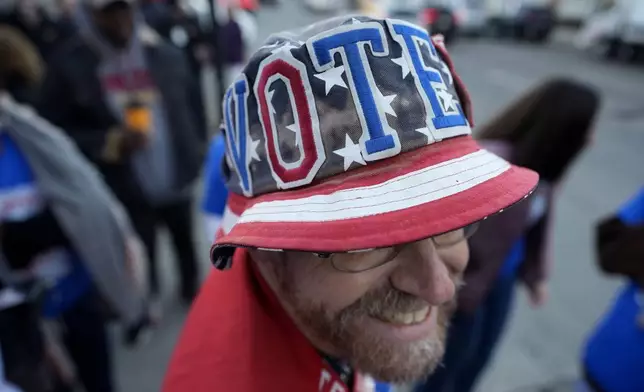 John Olsen, of Ankeny, Iowa, waits in line for early voting at the Polk County Election Office, Wednesday, Oct. 16, 2024, in Des Moines, Iowa. (AP Photo/Charlie Neibergall)