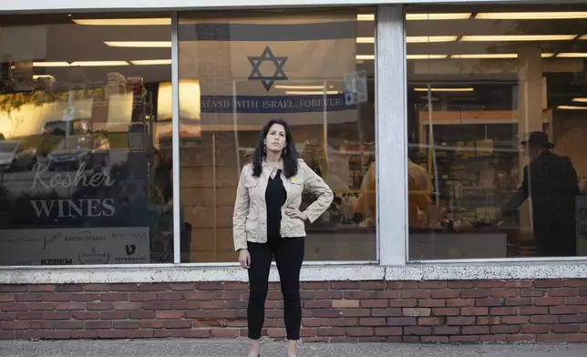 Rona Kaufman, a self-described progressive who is conflicted over who she will vote for in the presidential election, poses for a portrait in Squirrel Hill, a heavily Jewish neighborhood in Pittsburgh, Saturday, Oct. 20, 2024. (AP Photo/Rebecca Droke)