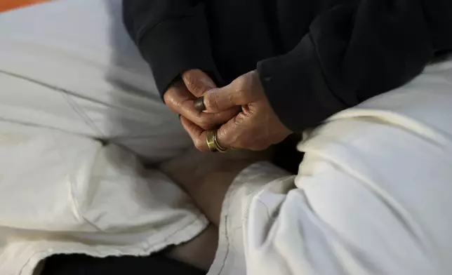 A detail view of the hands of Headspace meditation teacher, Rosie Acosta, is seen as she meditates in her studio Monday, Sept. 30, 2024, in Woodland Hills, Calif. (AP Photo/Jessie Alcheh)