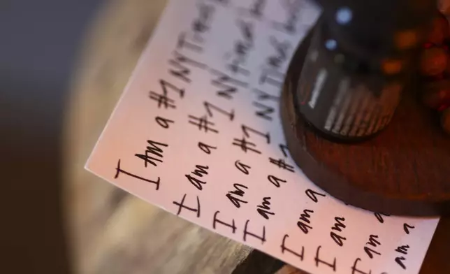 A detail view of a note card is seen in the studio space of Headspace meditation teacher, Rosie Acosta Monday, Sept. 30, 2024, in Woodland Hills, Calif. (AP Photo/Jessie Alcheh)