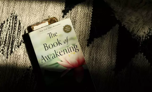 A detail view of a book is seen in the studio space of Headspace meditation teacher, Rosie Acosta Monday, Sept. 30, 2024, in Woodland Hills, Calif. (AP Photo/Jessie Alcheh)