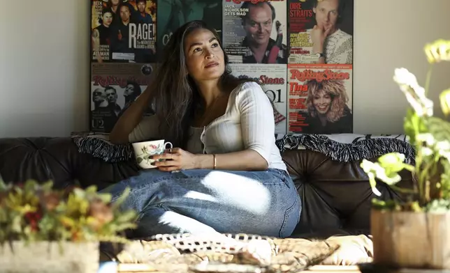 Headspace meditation teacher, Rosie Acosta, looks on in her living room Monday, Sept. 30, 2024, in Woodland Hills, Calif. (AP Photo/Jessie Alcheh)