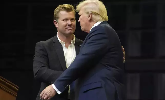 FILE- Republican presidential nominee former President Donald Trump shakes hands with Montana Senate candidate Tim Sheehy at a campaign rally in Bozeman, Mont., Friday, Aug. 9, 2024. (AP Photo/Rick Bowmer, File)