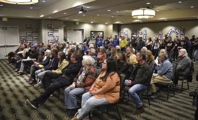 Supporters of U.S. Sen. Jon Tester, a Montana Democrat, are seen during a campaign rally for the three-term incumbent lawmaker in a hotel ballroom, Oct. 25, 2024, in Bozeman, Mont. (AP Photo/Matthew Brown)