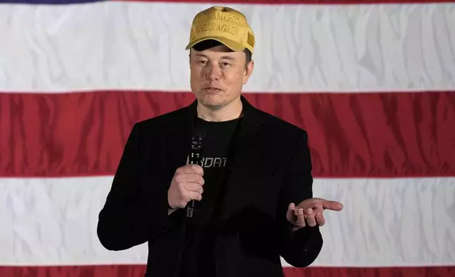 Elon Musk speaks as part of a campaign town hall in support of Republican presidential nominee former President Donald Trump in Folsom, Pa., Thursday, Oct. 17, 2024. (AP Photo/Matt Rourke)