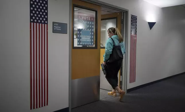 Cari-Ann Burgess, interim Registrar of Voters for Washoe County, Nev., arrives at the office Saturday, Sept. 21, 2024, in Reno, Nev. (AP Photo/John Locher)