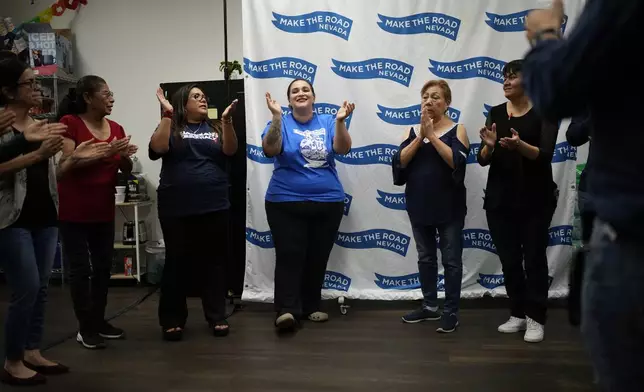 Erika Marquez, center, leads a meeting at the nonprofit Make the Road Nevada, where she works as the immigration and justice organizer, Thursday, Sept. 12, 2024, in Las Vegas. Marquez is a recipient of an Obama administration amnesty for immigrants brought to the U.S. illegally as children. (AP Photo/John Locher)