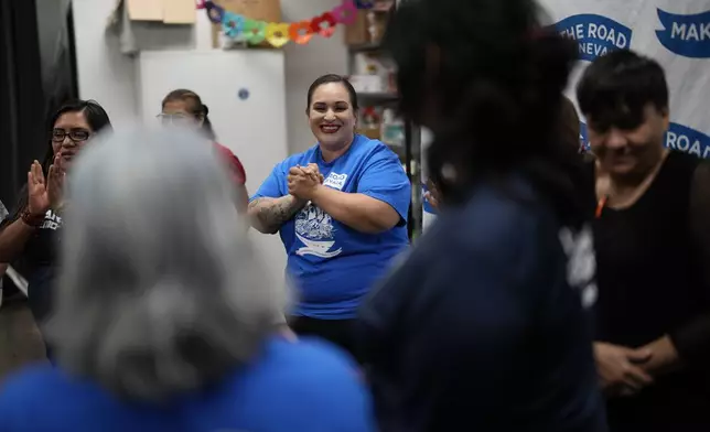 Erika Marquez, center, leads a meeting at the nonprofit Make the Road Nevada, where she works as the immigration and justice organizer, Thursday, Sept. 12, 2024, in Las Vegas. Marquez is a recipient of an Obama administration amnesty for immigrants brought to the U.S. illegally as children. (AP Photo/John Locher)