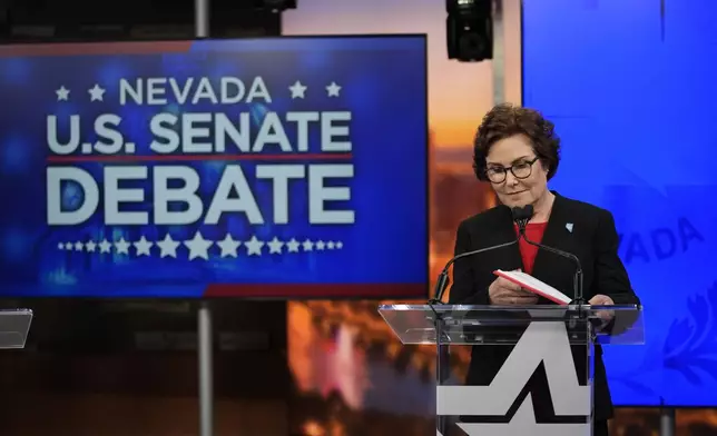 Sen. Jacky Rosen, D-Nev., prepares before a debate with Republican senatorial candidate Sam Brown, Thursday, Oct. 17, 2024, in Las Vegas. (AP Photo/John Locher)