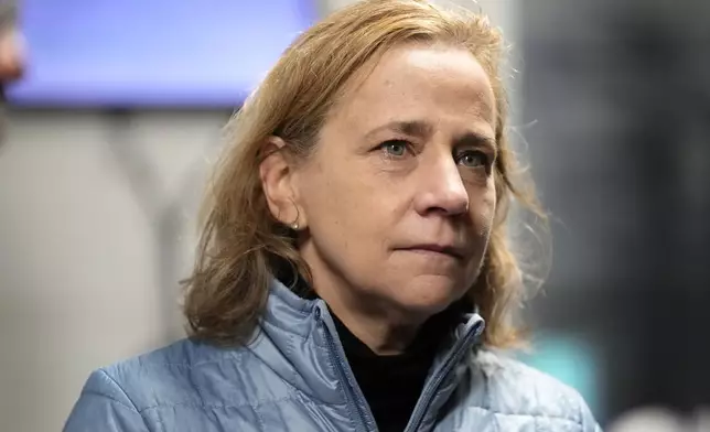 Joyce Craig, Democratic candidate for governor, listens to workers during a visit to the Milan Lumber mill, Wednesday, Oct. 16, 2024, in Milan, N.H. (AP Photo/Robert F. Bukaty)