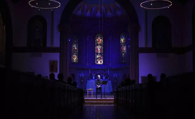 The Rev. David Peck, rector of St. James Episcopal Church, leads a "Contemplative Citizenship" service in Lancaster, Pa., on Tuesday, Oct. 15, 2024. (AP Photo/Jessie Wardarski)